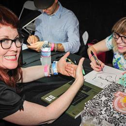 Kate Flannery of The Lampshades being caricatured by Kali Fontecchio of the Ego Killers at TwentyWonder 2014. Photo by Sam McCay.