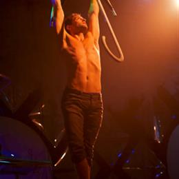 Umbrella aerialist Tavi of Cirque Berzerk presented by Way 2 Much Entertainment at TwentyWonder 2014. Photo by Guillermo Prieto.